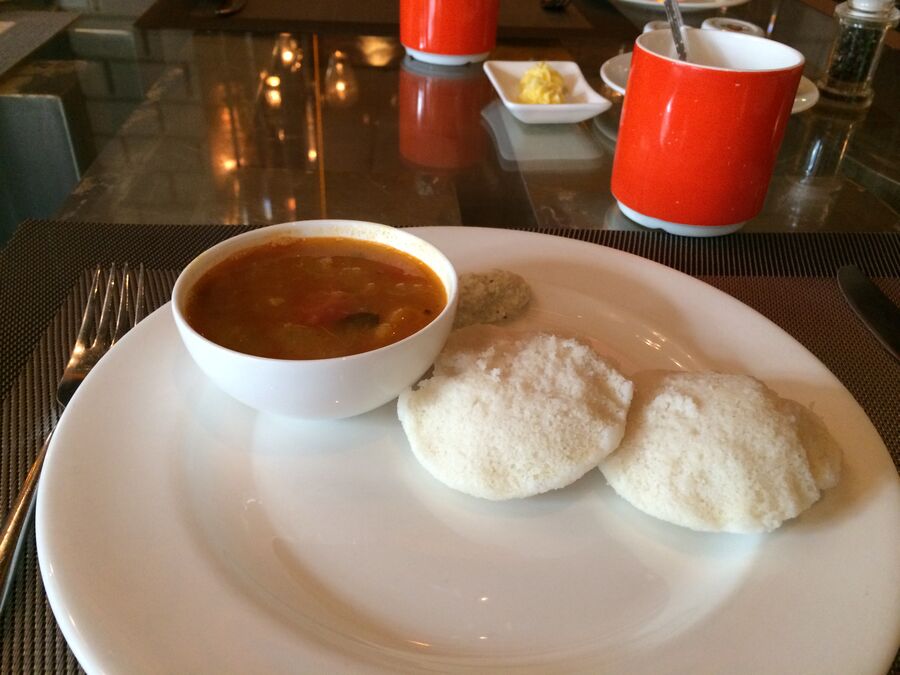 Idli served with sambar, chutney and vadai